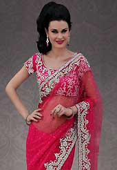 Breathtaking collection of sarees with stylish embroidery work and fabulous style. This pink net saree is nicely designed with embroidery patch work is done with stone and cutbeads work. Beautiful embroidery work on saree make attractive to impress all. This saree gives you a modern and different look in fabulous style. Matching blouse is available. Slight color variations are possible due to differing screen and photograph resolution.