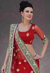 Get ready to sizzle all around you by sparkling saree. This red net lehenga style saree is nicely designed with embroidery and velvet patch work is done with resham, sequins, stone, cutbeads, zardosi and lace work. Beautiful embroidery work on saree make attractive to impress all. This saree gives you a modern and different look in fabulous style. Matching blouse is available. Slight color variations are possible due to differing screen and photograph resolution.