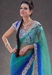 Ultimate collection of embroidered sarees with fabulous style. This shaded sea green and blue net saree is nicely designed with embroidery patch work is done with stone and cutbeads work. Beautiful embroidery work on saree make attractive to impress all. This saree gives you a modern and different look in fabulous style. Matching blouse is available. Slight color variations are possible due to differing screen and photograph resolution.