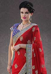 The most beautiful refinements for style and tradition. This red georgette saree is nicely designed with embroidery patch work is done with sequins, stone, zardosi and cutbeads work. Beautiful embroidery work on saree make attractive to impress all. This saree gives you a modern and different look in fabulous style. Contrasting blue blouse is available. Slight color variations are possible due to differing screen and photograph resolution.
