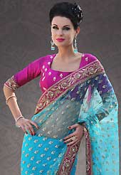Attract all attentions with this embroidered saree. This blue net saree is nicely designed with embroidery patch work is done with resham, sequins, stone, zardosi and cutbeads work. Beautiful embroidery work on saree make attractive to impress all. This saree gives you a modern and different look in fabulous style. Contrasting dark pink blouse is available. Slight color variations are possible due to differing screen and photograph resolution.