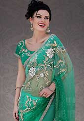 Try out this year top trend, glowing, bold and natural collection. This blue net saree is nicely designed with embroidery patch work is done with stone work. Beautiful embroidery work on saree make attractive to impress all. This saree gives you a modern and different look in fabulous style. Matching blouse is available. Slight color variations are possible due to differing screen and photograph resolution.