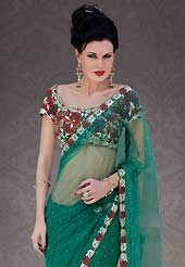 Try out this year top trend, glowing, bold and natural collection. This green net saree is nicely designed with embroidery patch work is done with resham, stone and cutbeads work. Beautiful embroidery work on saree make attractive to impress all. This saree gives you a modern and different look in fabulous style. Matching blouse is available. Slight color variations are possible due to differing screen and photograph resolution.