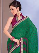 Different colors are a perfect blend of traditional Indian heritage and contemporary artwork. This beautiful green chiffon saree is nicely designed with dots, wave, floral print, zari lace and graceful patch border. Beautiful embroidered work on saree make attractive to impress all. It will enhance your personality and gives you a singular look. Contrasting magenta blouse is available with this saree. Slight color variations are due to differing screen and photography resolution.