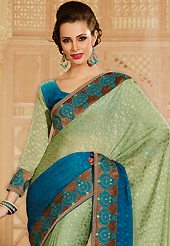 Elegance and innovation of designs crafted for you. This light olive green and blue chiffon jacquard saree is nicely designed with embroidery patch work is done with resham, zari, sequins, stone, kundan and pearls work. Saree gives you a singular and dissimilar look. Matching blouse is available. Slight color variations are possible due to differing screen and photograph resolution.