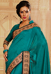 Take a look on the changing fashion of the season. This turquoise raw silk saree is nicely designed with embroidery patch work is done with zari and sequins work. Saree gives you a singular and dissimilar look. Matching blouse is available. Slight color variations are possible due to differing screen and photograph resolution.