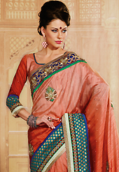 The evolution of style species collection spells pure femininity. This shaded rust raw silk saree is nicely designed with embroidery patch work is done with resham, zari, sequins, stone and lace work. Saree gives you a singular and dissimilar look. Matching blouse is available. Slight color variations are possible due to differing screen and photograph resolution.
