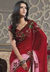It is color this season and bright shaded suits are really something that is totally in vogue. This dark red and shaded pink faux georgette saree have beautiful embroidery patch work which is embellished with resham, zari, stone, beads and lace work. Fabulous designed embroidery gives you an ethnic look and increasing your beauty. Matching blouse is available. Slight Color variations are possible due to differing screen and photograph resolutions.