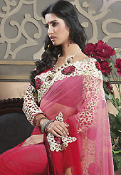 Dreamy variation on shape and forms compliment your style with tradition. This pink and red net saree have beautiful embroidery patch work which is embellished with resham, zari and stone work. Fabulous designed embroidery gives you an ethnic look and increasing your beauty. Matching blouse is available. Slight Color variations are possible due to differing screen and photograph resolutions.