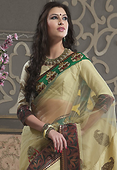 Take a look on the changing fashion of the season. This light fawn net and dupion silk saree have beautiful embroidery patch work which is embellished with resham, zari and stone work. Fabulous designed embroidery gives you an ethnic look and increasing your beauty. Matching blouse is available. Slight Color variations are possible due to differing screen and photograph resolutions.