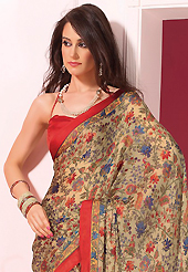 An occasion wear perfect is ready to rock you. This beautiful beige faux crepe saree is nicely designed with floral print work. Beautiful print work on saree make attractive to impress all. It will enhance your personality and gives you a singular look. Contrasting red blouse is available with this saree. Slight color variations are due to differing screen and photography resolution.