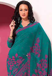 Ultimate collection of embroidered sarees with fabulous style. This beautiful teal green and pink faux crepe saree is nicely designed with floral and geometric print work. Beautiful print work on saree make attractive to impress all. It will enhance your personality and gives you a singular look. Matching blouse is available with this saree. Slight color variations are due to differing screen and photography resolution.