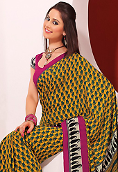 Get ready to sizzle all around you by sparkling saree. This beautiful mustard and teal green faux crepe saree is nicely designed with paisley print work. Beautiful print work on saree make attractive to impress all. It will enhance your personality and gives you a singular look. Contrasting magenta blouse is available with this saree. Slight color variations are due to differing screen and photography resolution.