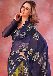 Exquisite combination of color, fabric can be seen here. This beautiful navy blue and light olive green faux georgette saree is nicely designed with floral and abstract print work. Beautiful print work on saree make attractive to impress all. It will enhance your personality and gives you a singular look. Matching blouse is available with this saree. Slight color variations are due to differing screen and photography resolution.