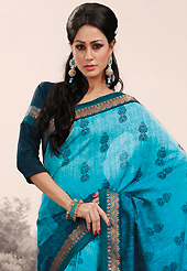 Take the fashion industry by storm in this beautiful embroidered saree. This shaded turquoise blue saree is nicely designed with abstract print and embroidered patch work is done with resham and zari work. Saree gives you a singular and dissimilar look. Matching blouse is available. Slight color variations are possible due to differing screen and photograph resolution.