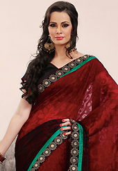 Exquisite combination of color, fabric can be seen here. This maroon brasso faux georgette saree is nicely designed with embroidered patch work is done with resham and zari work. Saree gives you a singular and dissimilar look. Matching blouse is available. Slight color variations are possible due to differing screen and photograph resolution.