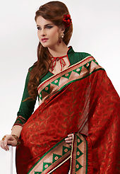 The evolution of style species collection spells pure femininity. This maroon crepe silk saree is nicely designed with paisley print and embroidered patch work is done with self weaving zari and lace work. Saree gives you a singular and dissimilar look. Contrasting dark green blouse is available. Slight color variations are possible due to differing screen and photograph resolution.