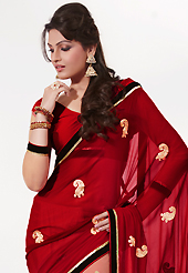 Ultimate collection of embroidery sarees with fabulous style. This maroon and cream georgette saree is nicely designed with embroidered patch work is done with resham and sequins work. Saree gives you a singular and dissimilar look. Matching blouse is available. Slight color variations are possible due to differing screen and photograph resolution.