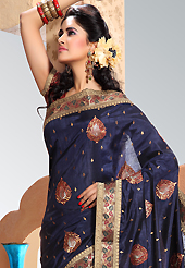 Elegance and innovation of designs crafted for you. This navy blue art silk saree is nicely designed with embroidered patch work is done with resham and zari work. Saree gives you a singular and dissimilar look. Matching blouse is available. Slight color variations are possible due to differing screen and photograph resolution.