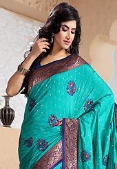 Exquisite combination of color, fabric can be seen here. This turquoise blue art silk saree is nicely designed with embroidered patch work is done with resham and zari work. Saree gives you a singular and dissimilar look. Contrasting dark blue blouse is available. Slight color variations are possible due to differing screen and photograph resolution.