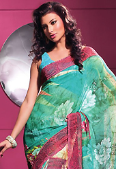 Exquisite combination of color, fabric can be seen here. This beautiful turquoise and black faux georgette saree is nicely designed with geometric and abstract print work. Beautiful print work on saree make attractive to impress all. It will enhance your personality and gives you a singular look. Matching blouse is available with this saree. Slight color variations are due to differing screen and photography resolution.