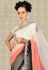 Take a look on the changing fashion of the season. This off white, peach and black chiffon saree is nicely designed with embroidery patch work is done with resham, cutdana and stone work. This saree gives you a modern and different look in fabulous style. Matching blouse is available with this saree. Slight color variations are possible due to differing screen and photograph resolution.