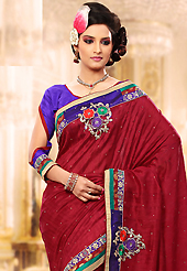 Welcome to the new era of Indian fashion wear. This maroon jacquard bhagalpuri silk saree is nicely designed with embroidery patch work is done with resham, zari and stone work. Saree gives you a singular and dissimilar look. Contrasting purple blouse is available. Slight color variations are possible due to differing screen and photograph resolution.