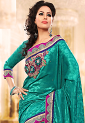 The most beautiful refinements for style and tradition. This turquoise jacquard art silk saree is nicely designed with embroidery patch work is done with resham, zari, beads and stone work. Saree gives you a singular and dissimilar look. Matching blouse is available. Slight color variations are possible due to differing screen and photograph resolution.