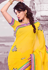 Try out this year top trend, glowing, bold and natural collection. This yellow chiffon saree is nicely designed with embroidered patch work is done with resham, zari, stone and lace work. Saree gives you a singular and dissimilar look. Matching blouse is available. Slight color variations are possible due to differing screen and photograph resolution.