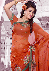 The evolution of style species collection spells pure femininity. This rust shimmer georgette saree is nicely designed with embroidered patch work is done with resham, zari, sequins and cutbeads work. Saree gives you a singular and dissimilar look. Matching blouse is available. Slight color variations are possible due to differing screen and photograph resolution.
