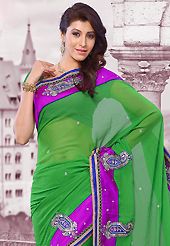 Get ready to sizzle all around you by sparkling saree. This green chiffon saree is nicely designed with embroidered patch work is done with resham, zari, sequins, stone and lace work. Saree gives you a singular and dissimilar look. Matching blouse is available. Slight color variations are possible due to differing screen and photograph resolution.