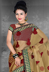 An casual wear perfect is ready to rock you. This fawn and maroon net and brocade saree is nicely designed with embroidered patch work is done with resham, zari and stone work. Saree gives you a singular and dissimilar look. Matching blouse is available. Slight color variations are possible due to differing screen and photograph resolution.