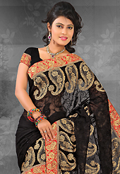 Try out this year top trend, glowing, bold and natural collection. This black chiffon saree is nicely designed with embroidered patch work is done with resham, zari, stone and lace work. Saree gives you a singular and dissimilar look. Matching blouse is available. Slight color variations are possible due to differing screen and photograph resolution.