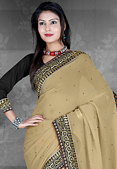 Take the fashion industry by storm in this beautiful embroidered saree. This dusty beige chiffon saree is nicely designed with embroidered patch work is done with resham, zari, stone and lace work. Saree gives you a singular and dissimilar look. Contrasting black blouse is available. Slight color variations are possible due to differing screen and photograph resolution.