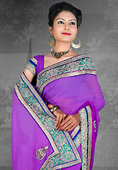 Style and trend will be at the peak of your beauty when you adorn this saree. This bluish purple chiffon saree is nicely designed with embroidered patch work is done with resham, zari, stone and lace work. Saree gives you a singular and dissimilar look. Matching blouse is available. Slight color variations are possible due to differing screen and photograph resolution.