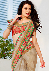The fascinating beautiful subtly garment with lovely patterns. This beige super net jacquard saree is nicely designed with embroidered patch work is done with resham and zari work. Beautiful embroidery work on saree make attractive to impress all. Matching blouse is available. Slight color variations are possible due to differing screen and photograph resolution.