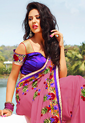 A desire that evokes a sense of belonging with a striking details. This dusty pink chiffon saree is nicely designed with embroidered patch work is done with resham and zari work. Beautiful embroidery work on saree make attractive to impress all. Contrasting purple blouse is available. Slight color variations are possible due to differing screen and photograph resolution.