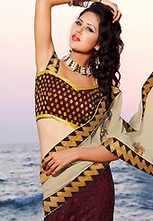 An occasion wear perfect is ready to rock you. This beige and maroon chiffon and brosso lehenga style saree is nicely designed with embroidered patch work is done with resham, zari and kasab work. Beautiful embroidery work on saree make attractive to impress all. Matching blouse is available. Slight color variations are possible due to differing screen and photograph resolution.