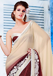 The evolution of style species collection spells pure femininity. This cream and brown chiffon and jacquard saree is nicely designed with embroidered patch work is done with resham and lace work. Beautiful embroidery work on saree make attractive to impress all. Matching blouse is available. Slight color variations are possible due to differing screen and photograph resolution.
