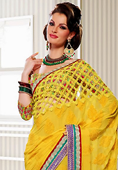 It is color this season and bright shaded suits are really something that is totally in vogue. This yellow georgette saree have beautiful embroidery patch work which is embellished with resham, zari and lace work. Fabulous designed embroidery gives you an ethnic look and increasing your beauty. Matching blouse is available. Slight Color variations are possible due to differing screen and photograph resolutions.