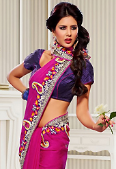 A desire that evokes a sense of belonging with a striking details. This magenta crepe jacquard saree have beautiful embroidery patch work which is embellished with resham, zari and stone work. Fabulous designed embroidery gives you an ethnic look and increasing your beauty. Contrasting purple blouse is available. Slight Color variations are possible due to differing screen and photograph resolutions.