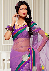 Let your personality articulate for you with this amazing embroidered saree. This shaded purple net and georgette saree have beautiful embroidery patch work which is embellished with resham and zari work. Fabulous designed embroidery gives you an ethnic look and increasing your beauty. Matching blouse is available. Slight Color variations are possible due to differing screen and photograph resolutions.
