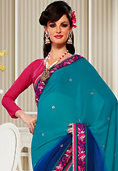 Style and trend will be at the peak of your beauty when you adorn this saree. This turquoise and blue georgette saree have beautiful embroidery patch work which is embellished with resham, zari, stone and lace work. Fabulous designed embroidery gives you an ethnic look and increasing your beauty. Contrasting deep pink blouse is available. Slight Color variations are possible due to differing screen and photograph resolutions.