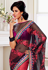 Your search for elegant look ends here with this lovely saree. This black and deep pink net and crepe jacquard saree have beautiful embroidery patch work which is embellished with resham, zari, sequins and lace work. Fabulous designed embroidery gives you an ethnic look and increasing your beauty. Contrasting magenta and black blouse is available. Slight Color variations are possible due to differing screen and photograph resolutions.