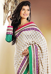 Take a look on the changing fashion of the season. This beige brocade saree is nicely designed with embroidery patch work is done with zari and stone work. Beautiful embroidery work on saree make attractive to impress all. This saree gives you a modern and different look in fabulous style. Contrasting green blouse is available. Slight color variations are possible due to differing screen and photograph resolution.