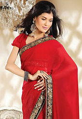 Your search for elegant look ends here with this lovely saree. This red, black and off white georgette saree is nicely designed with dot print and embroidery patch work is done with resham, zari, sequins, stone and beads work. Beautiful embroidery work on saree make attractive to impress all. This saree gives you a modern and different look in fabulous style. Matching blouse is available. Slight color variations are possible due to differing screen and photograph resolution.