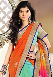 Let your personality articulate for you with this amazing embroidered saree. This orange, pink and sea green net and georgette saree is nicely designed with embroidery patch work is done with resham, zari, stone and lace work. Beautiful embroidery work on saree make attractive to impress all. This saree gives you a modern and different look in fabulous style. Matching blouse is available. Slight color variations are possible due to differing screen and photograph resolution.