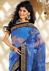 Exquisite combination of color, fabric can be seen here. This blue net saree is nicely designed with embroidery patch work is done with zari, stone, beads and lace work. Beautiful embroidery work on saree make attractive to impress all. This saree gives you a modern and different look in fabulous style. Matching blouse is available. Slight color variations are possible due to differing screen and photograph resolution.