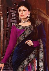 Style and trend will be at the peak of your beauty when you adorn this saree. This navy blue, magenta and red velvet, viscose and brocade lehenga style saree have beautiful embroidery patch work which is embellished with resham, zari, stone and lace work. Fabulous designed embroidery gives you an ethnic look and increasing your beauty. Matching magenta blouse is available. Slight Color variations are possible due to differing screen and photograph resolutions.