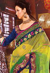 The most beautiful refinements for style and tradition. This yellow, green and dark pink net and faux georgette lehenga style saree have beautiful embroidery patch work which is embellished with resham, zari, stone and beaded lace work. Fabulous designed embroidery gives you an ethnic look and increasing your beauty. Contrasting dark blue blouse is available. Slight Color variations are possible due to differing screen and photograph resolutions.